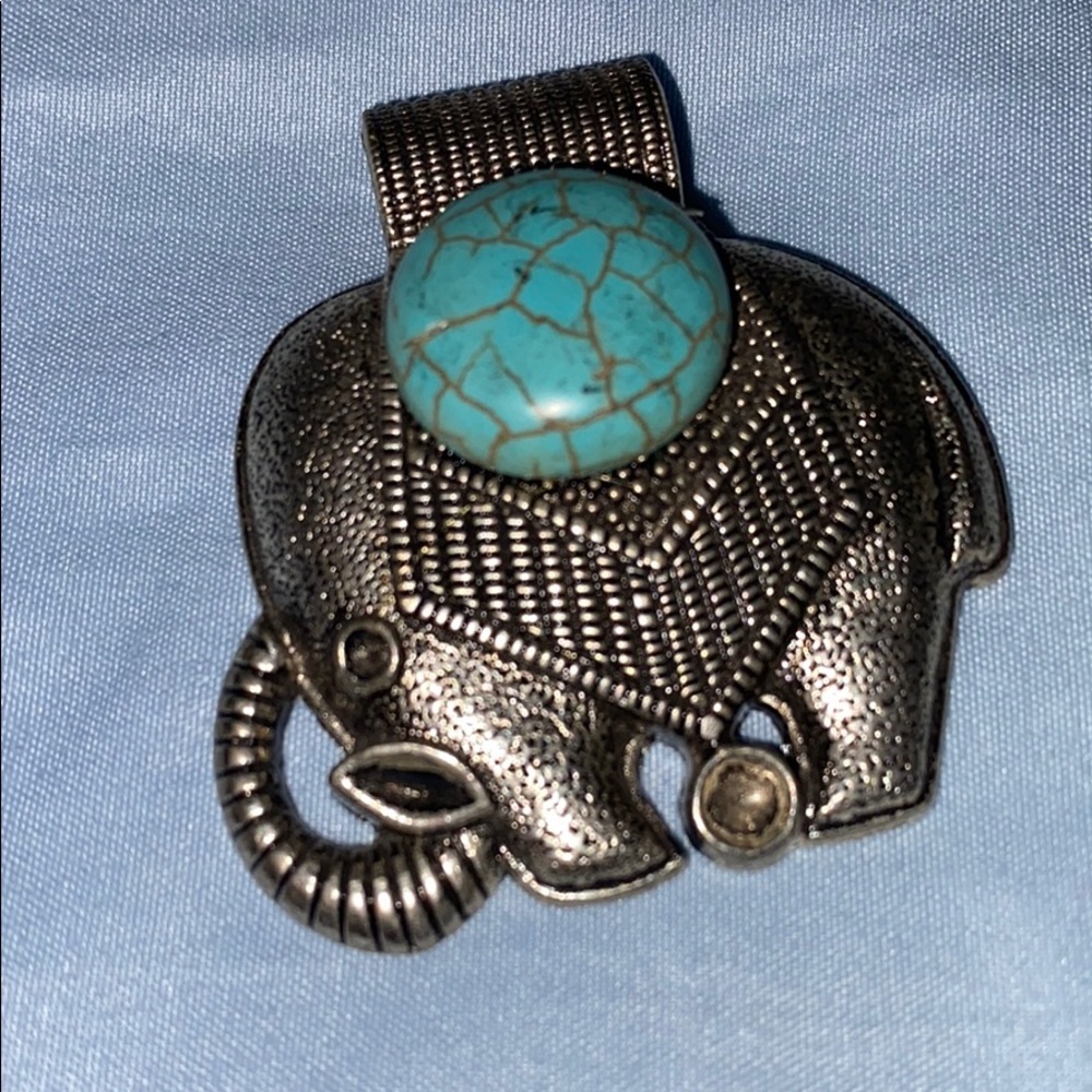 Elephant with blue stone necklace